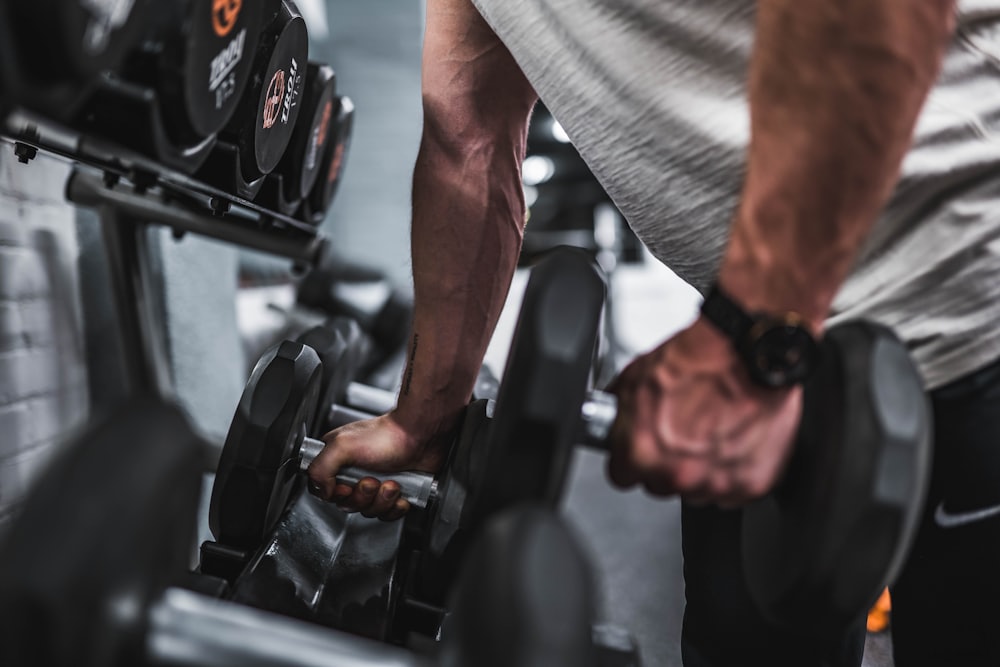 Athlete gripping dumbbells